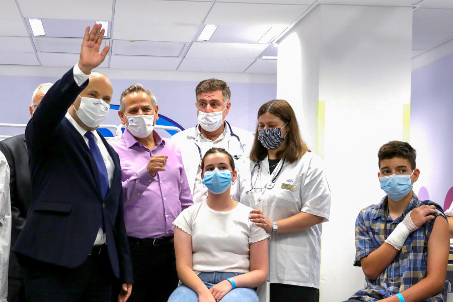 Prime Minister Prime Minister Naftali Bennett and Health Minister Nitzan Horowitz attend a press conference at a Maccabi vaccine center in Holon on June 29, 2021. (Photo: Marc Israel Sellem/POOL)