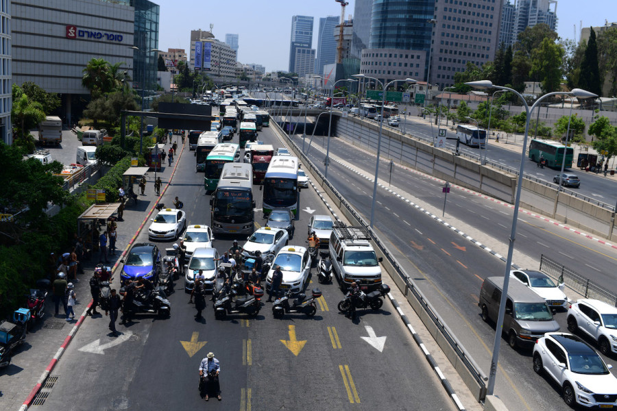 Disabled, handicapped and other activists block the Ayalon Highway in Tel Aviv as they protest for better health care, July 25, 2021. (Photo: Tomer Neuberg/Flash90)