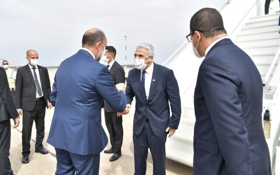 Morocco's Deputy Foreign Minister Mohcine Jazouli greets Israeli Foreign Minister Yair Lapid (center) at Rabat-Sale International Airport, August 11, 2021 (Photo: Shlomi Amsalem/GPO)