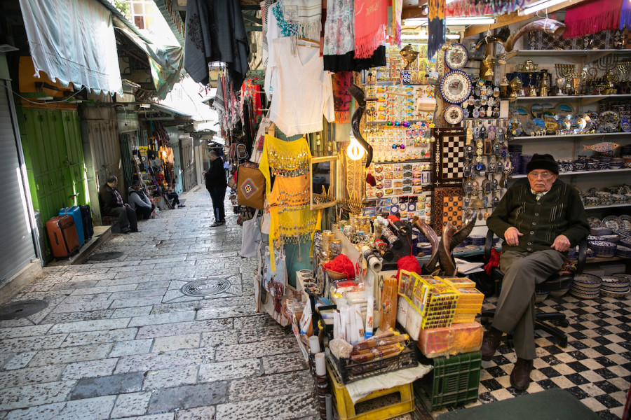 A shop owner sits in his empty store at the tourist market in the Old City of Jerusalem, March 16, 2020. (Photo: Olivier Fitoussi/Flash90)