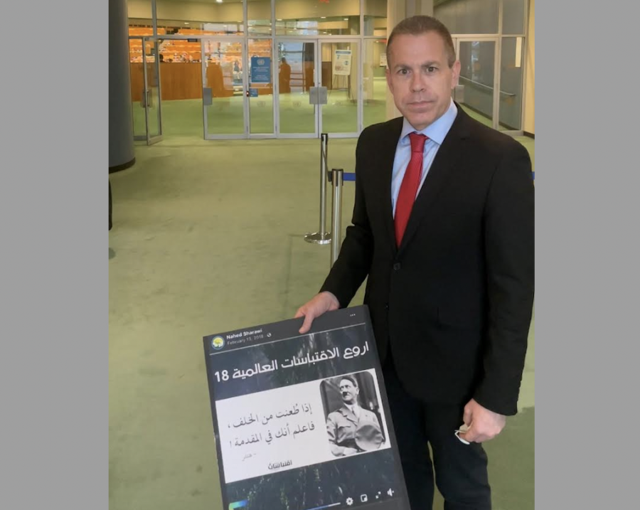 Israel's Ambassador to the United States and the United Nations Gilad Erdan with a picture showing anti-Semitism and incitement by UNRWA teachers on social media (Photo: courtesy)