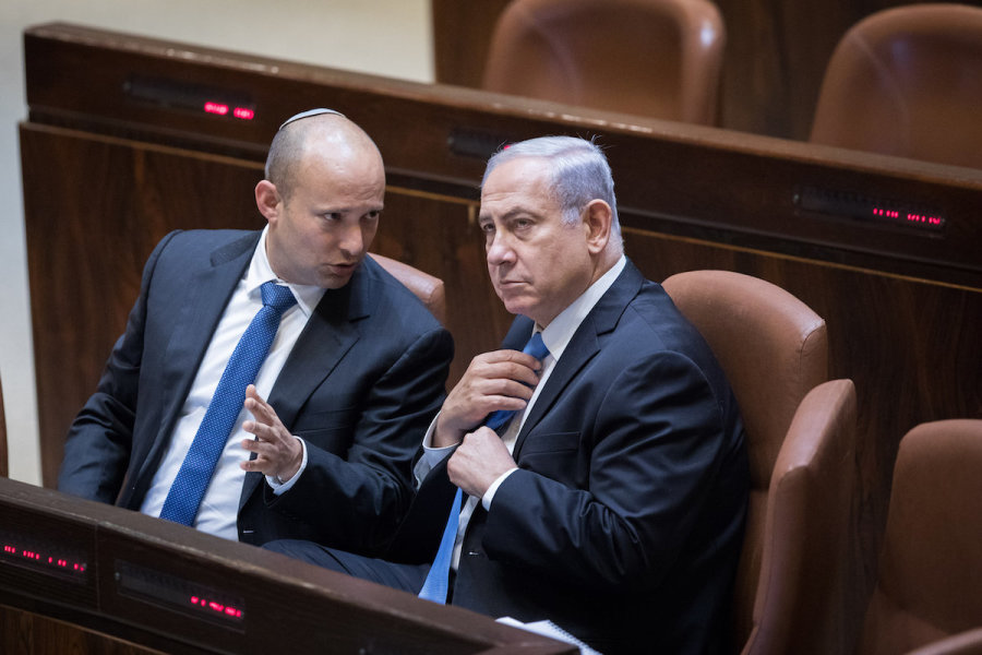 File photo - Then Israeli Prime Minister Benjamin Netanyahu speaks with then Education Minister Naftali Bennett during a Knesset session, Nov. 13, 2017. (Photo: Yonatan Sindel/Flash90)