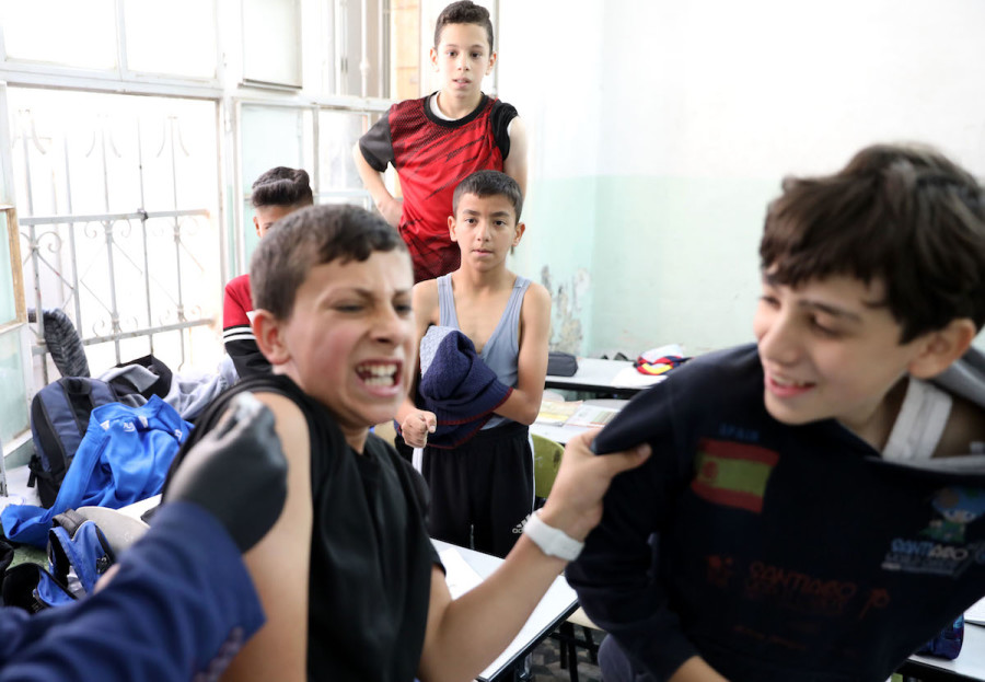 Children aged 12-15 receive their first dose of the COVID-19 vaccine at their school in Hebron, Nov. 24, 2021. (Photo: Wisam Hashlamoun/Flash90)