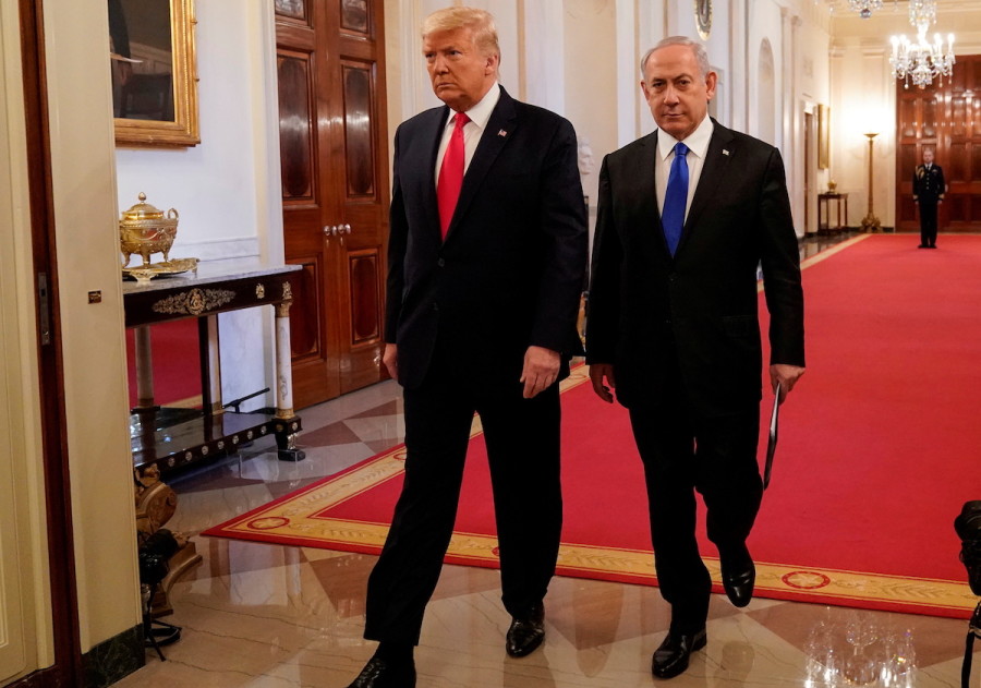 U.S. President Donald Trump and Israeli Prime Minister Benjamin Netanyahu arrive to deliver joint remarks on a Middle East peace plan proposal in the East Room of the White House in Washington, U.S., Jan. 28, 2020. (Photo: Joshua Roberts/Reuters)