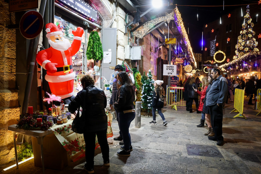 People enjoy Christmas festivities at the New Gate in the Old City of Jerusalem, Dec. 16, 2021. (Photo: Nati Shohat/Flash90)