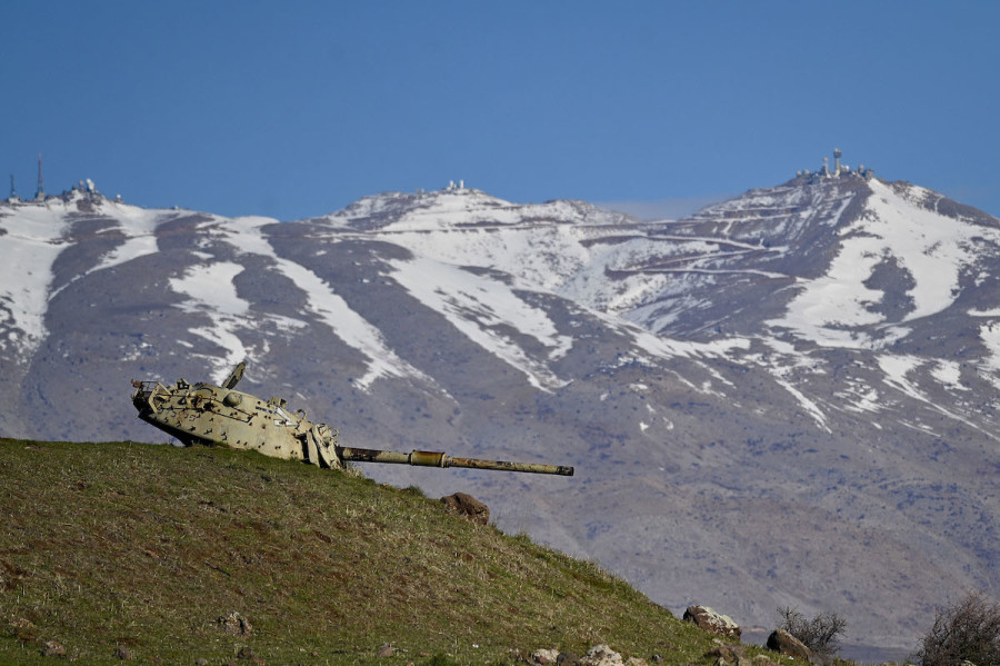 An old tank seen on Israel's northern border with Syria with Mount Hermon in the background, Jan. 3, 2021. (Photo: Michael Giladi/Flash90)