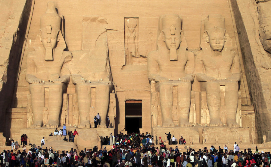 Tourists and visitors line up outside the temple of Abu Simbel at the upper reaches of the Nile in Aswan, around 1264 km (785 miles) south of Cairo, to see the dawn light up the temple's inner sanctum to mark the anniversary of Pharoah Ramses II's coronation, Feb. 22, 2014, (Photo: REUTERS/Mohamed Abd El Ghany)
