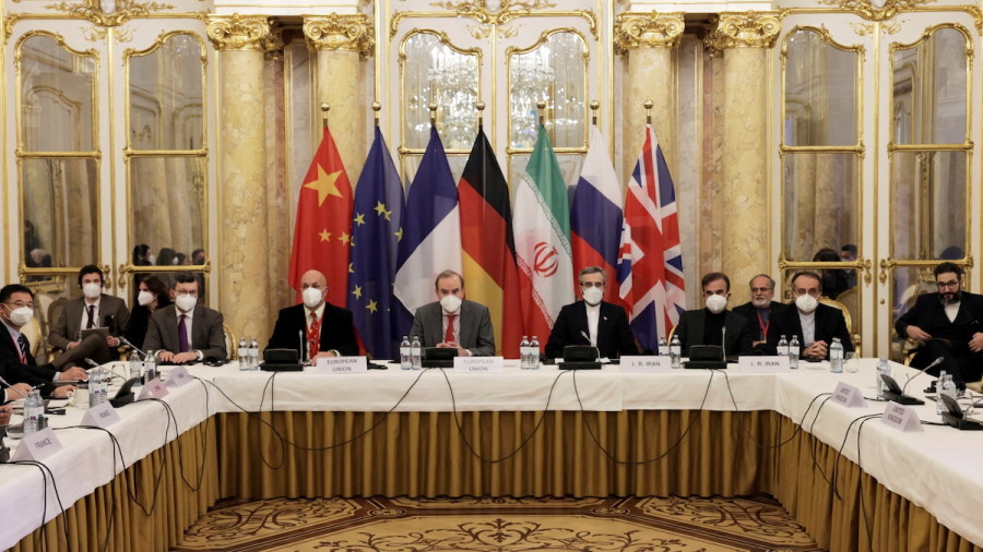 Deputy Secretary General of the European External Action Service (EEAS) Enrique Mora, Iran's chief nuclear negotiator Ali Bagheri Kani and delegations wait for the start of a meeting of the JCPOA Joint Commission in Vienna, Austria, Dec. 17, 2021. (Photo: EU Delegation in Vienna/EEAS/Handout via REUTERS)