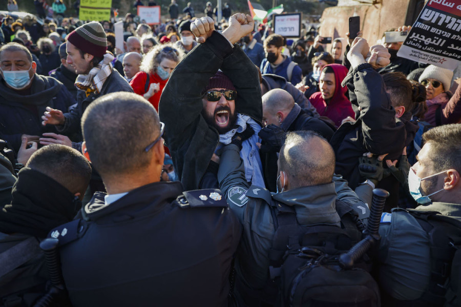 Palestinians and left-wing Israeli activists protest against the expulsion of Palestinian families from their homes in the East Jerusalem neighborhood Sheikh Jarrah, January 21, 2022. (Photo: Olivier Fitoussi/Flash90)