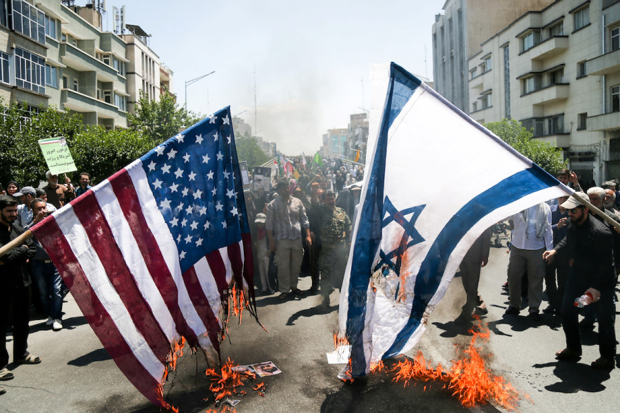 Iranians burn American and Israeli flags during a protest marking the annual al-Quds Day (Jerusalem Day) on the last Friday of the holy month of Ramadan in Tehran, Iran, June 8, 2018. (Photo: Tasnim News Agency/via Reuters)