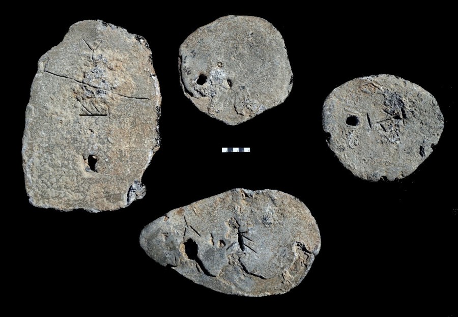 Four lead ingots recovered near Caesarea. (Photo: Hebrew University)