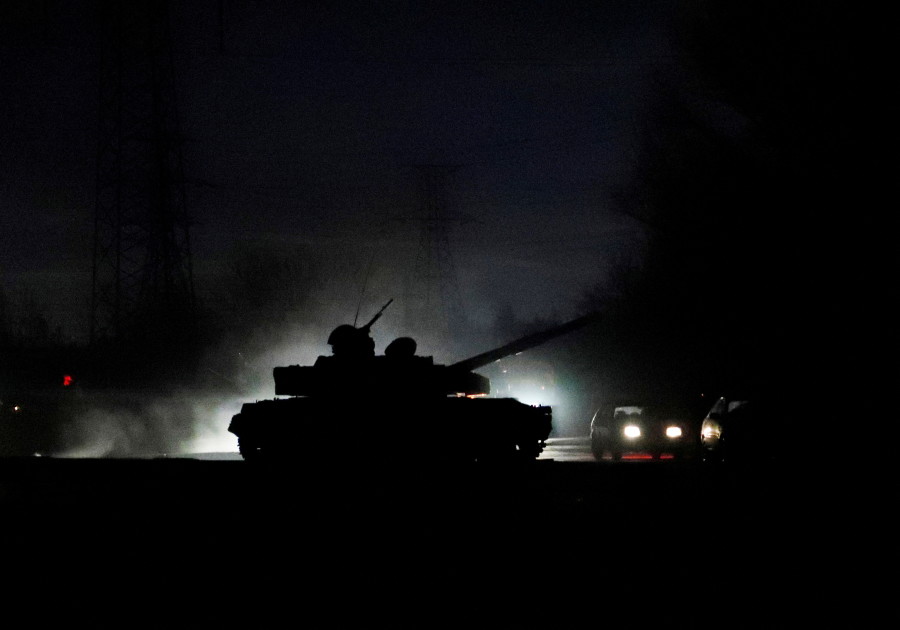 A tank drives along a street after Russian President Vladimir Putin ordered the deployment of Russian troops to two breakaway regions in eastern Ukraine following the recognition of their independence, in the separatist-controlled city of Donetsk, Ukraine, Feb. 22, 2022. (Photo: REUTERS/Alexander Ermochenko TPX IMAGES OF THE DAY)