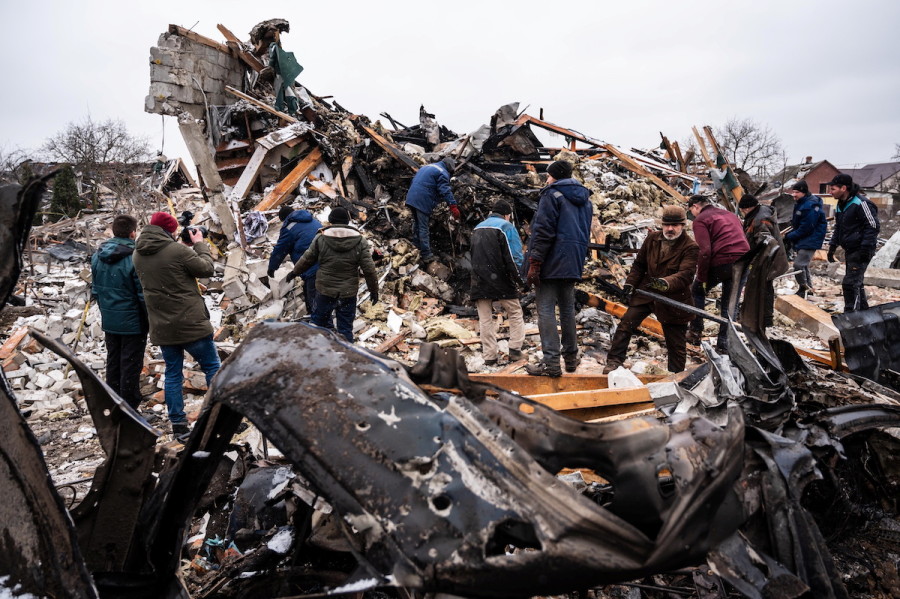Local residents work among remains of a residential building destroyed by Russian shelling as a part of the invasion of Ukraine, in Zhytomyr, Ukraine, Mar. 2, 2022. (Reuters/Viacheslav Ratynskyi)