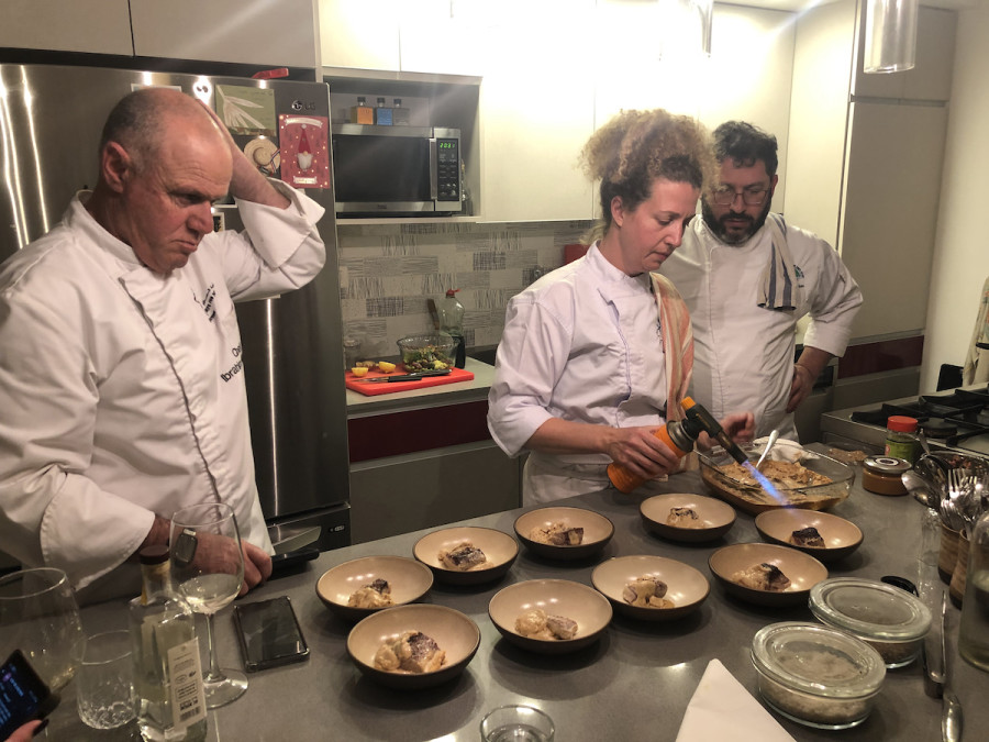 Chefs for Peace working in the kitchen together. (Photo: Carrie Hart)