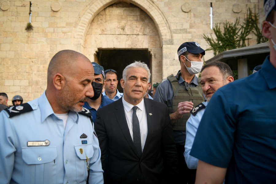 Israeli Foreign Minister Yair Lapid, Chief of Police Kobi Shabtai and Head of Jerusalem Police District Doron Turgeman visit the Damascus Gate in Jerusalem's Old City, April 3, 2022. (Photo: Arie Leib Abrams/Flash90)