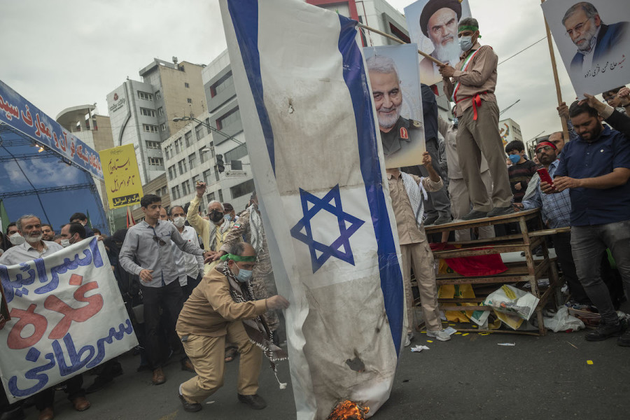Iranians burn an Israeli flag in downtown Tehran during a rally commemorating the International Quds Day, also known as Jerusalem Day, on Apr. 29, 2022. (Photo: Morteza Nikoubazl/NurPhoto)