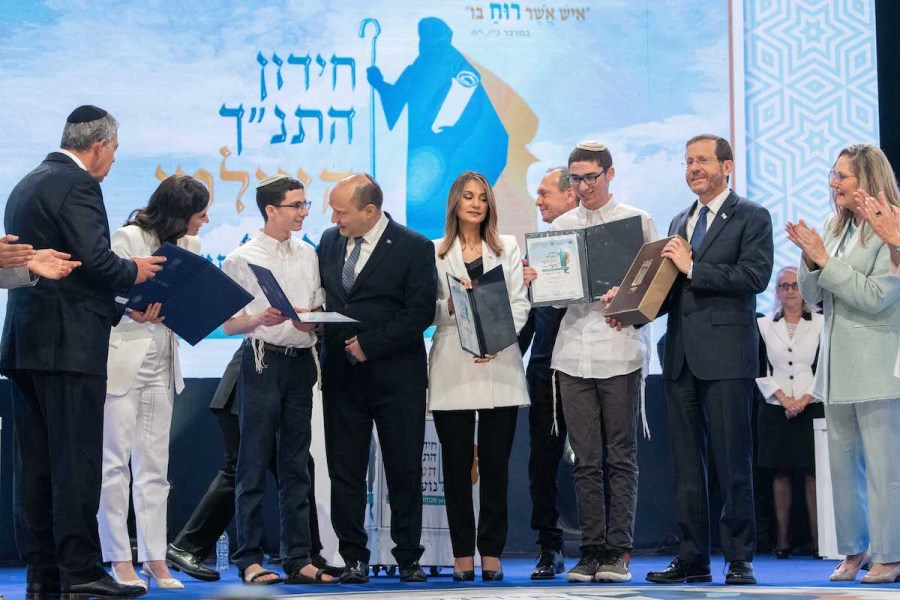 Israeli President Isaac Herzog, Prime Minister Naftali Bennett and Education Minister Yifat Shasha-Biton with winners of the Bible Quiz at the annual contest held at the Jerusalem Theater on Israel's Independence Day, May 5, 2022. (Photo: Arie Leib Abrams/Flash90)