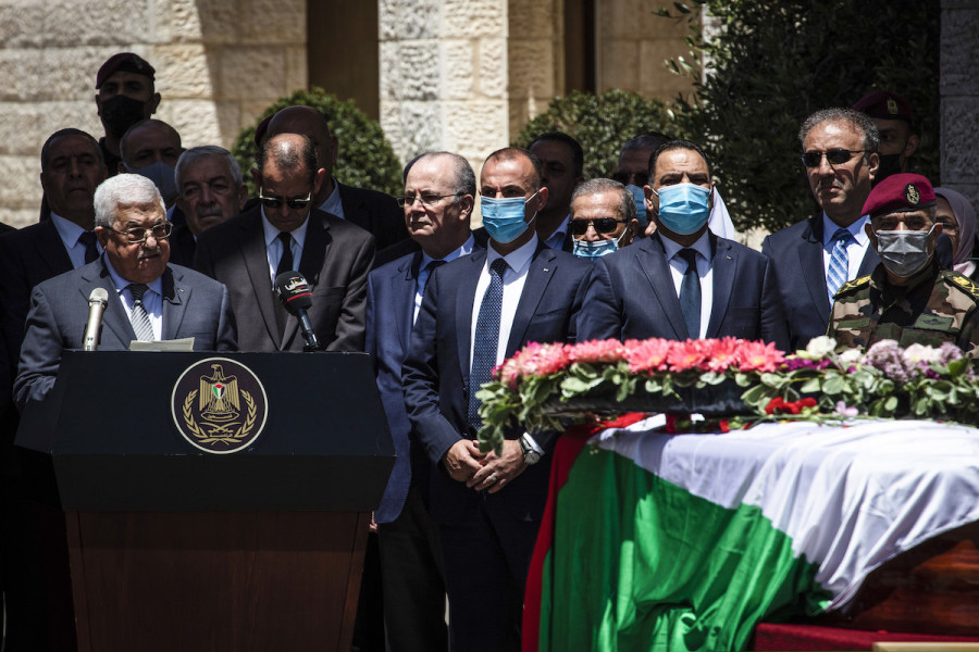 Palestinian Authority President Mahmoud Abbas delivers a speech behind the flag-wrapped coffin of Al Jazeera reporter, Shireen Abu Akleh, during a state funeral at the President's Residency in Ramallah, May 12, 2022 (Photo: DPA/Picture Alliance via Reuters)