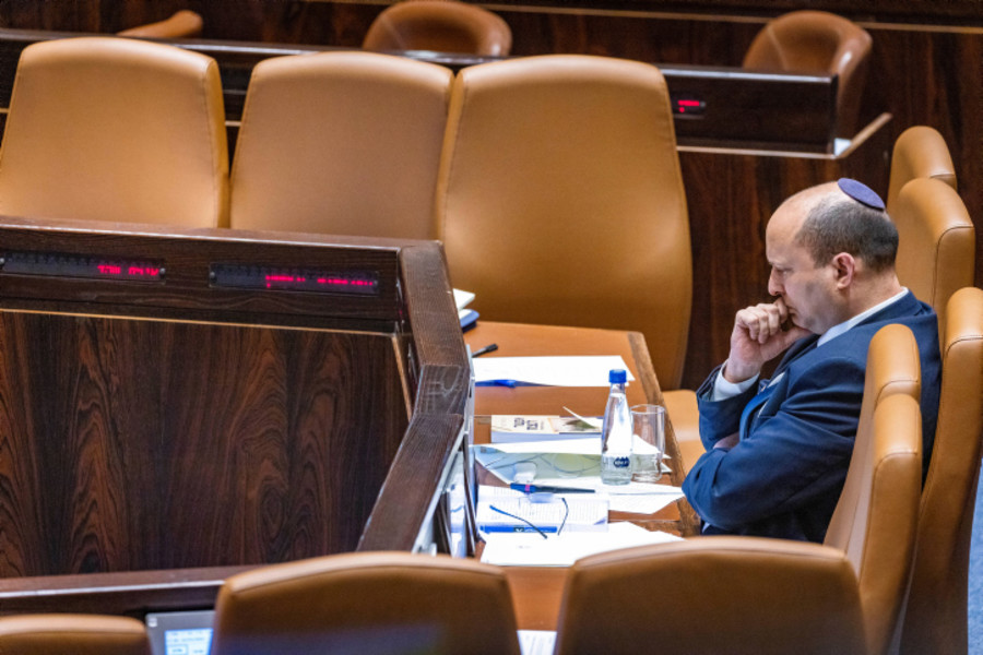 Israeli Prime Minister Naftali Bennett sits alone during a plenum session in the assembly hall of the Israeli parliament on May 16, 2022. (Photo: Olivier Fitoussi/FLASH90)