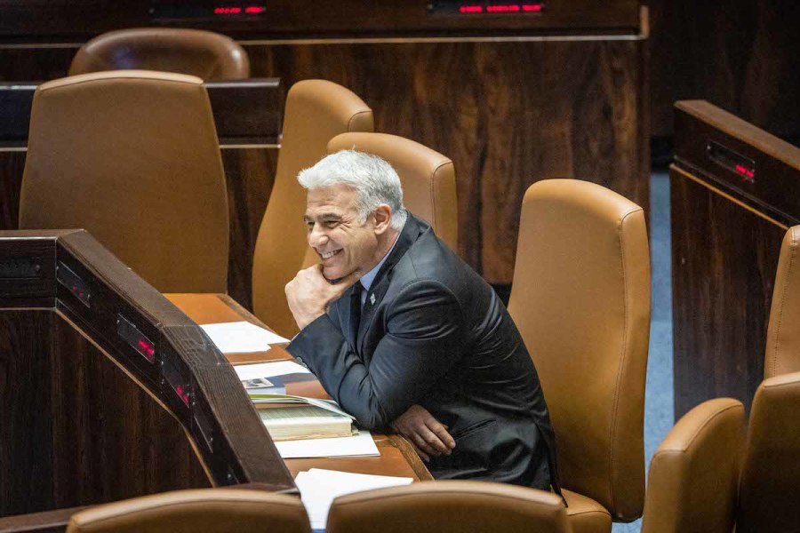 Foreign Minister Yair Lapid at the plenum hall of the Knesset, June 13, 2022. (Photo: Yonatan Sindel/Flash90)
