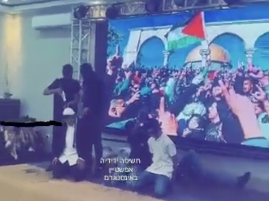 A scene in a high school play at the Anata High School for boys in East Jerusalem in which students dressed as gunmen "shoot" students dressed as religious Jews, July 20, 2022. (Photo: Screenshot)