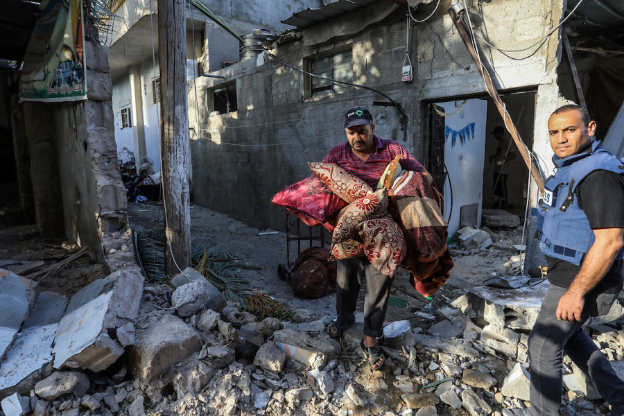 Palestinians gather at the scene where senior commander of Islamic Jihad militant group Khaled Mansour was killed in Israeli strikes, in Rafah in the southern Gaza Strip, August 7, 2022. (Photo: Attia Muhammed/Flash90