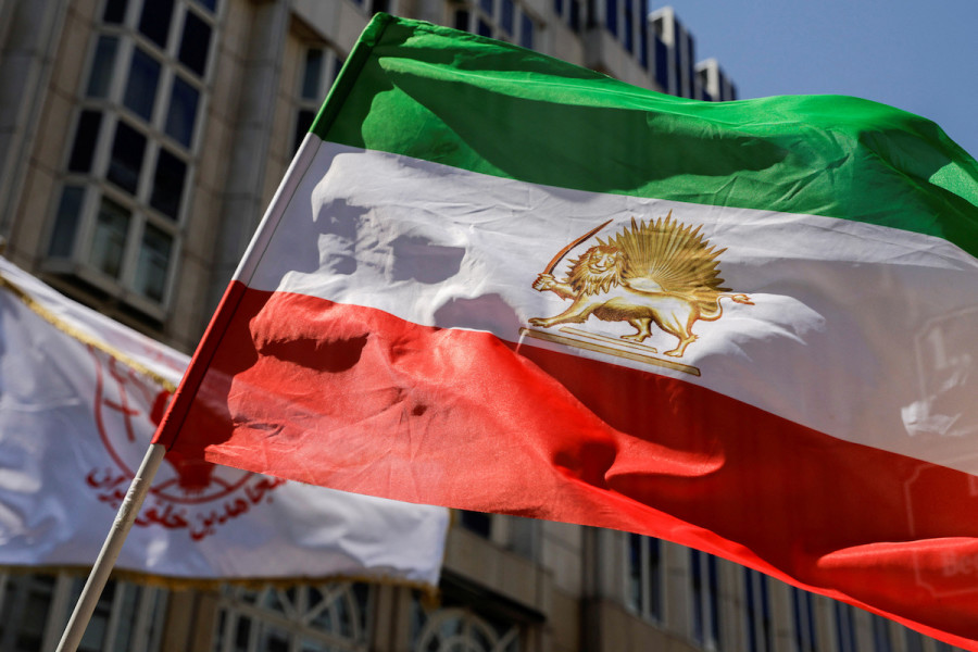 A flag is waved in front of Palais Coburg where closed-door nuclear talks with Iran take place in Vienna, Austria, August 4, 2022. (Photo: REUTERS/Lisa Leutner)