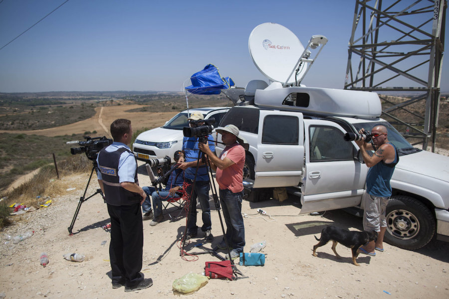 Illustrative - Media representative broadcasting from the Israel-Gaza border, on the second day of Operation Protective Edge, July 9, 2014. (Photo: Yonatan Sindel/Flash90)
