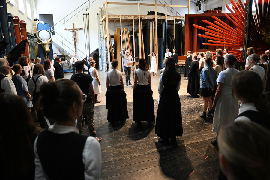 Members of the Oberammergau Passion Play choir singing backstage. (Photo: Angelika Warmuth/DPA)