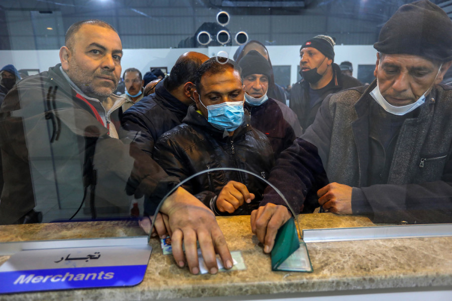 Palestinian workers wait at the Erez crossing in Beit Hanun, in the northern Gaza Strip, to enter Israel for work, March 13, 2022. (Photo: Attia Muhammed/Flash90