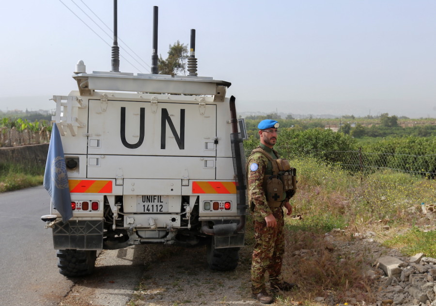 A UN peacekeeper stands next to a UN vehicle in Al Qulaylah in southern Lebanon, April 25, 2022. (Photo: Aziz Taher/Reuters)