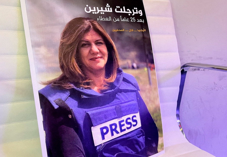 A picture of reporter Shireen Abu Akleh is displayed at the Al-Jazeera headquarters building in Doha, Qatar, May 11, 2022. (Photo: REUTERS/Imad Creidi)