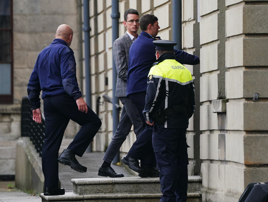 Irish schoolteacher Enoch Burke (second left) arriving at the High Court, Dublin, after he was committed to Mountjoy Prison in Dublin (CREDIT PA via Reuters)
