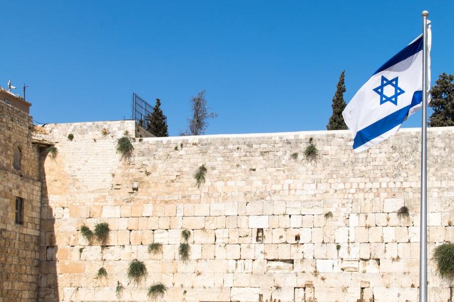 An Israeli flag in front of the Western Wall in Jerusalem's Old City