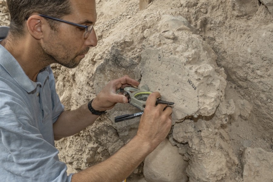 Tel Aviv University PhD student Yoav Vaknin measuring at the Tel Batash (biblical Timnah) archaeological site in Israel. (Photo: Tel Aviv University)