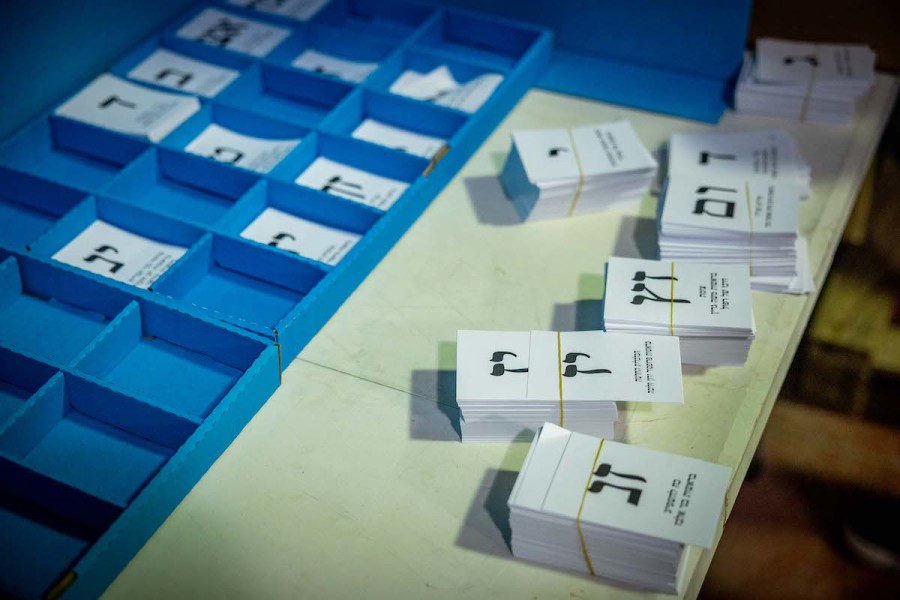 Workers prepare ballot boxes for the upcoming Israeli elections, at the central elections committee warehouse in Shoham, before they are shipped to polling stations, Oct. 12, 2022. (Photo: Yonatan Sindel/Flash90)