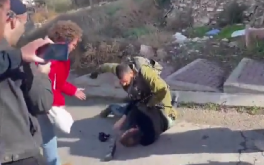 An Israeli soldier is seen hitting a left-wing activist in Hebron, Nov. 25, 2022. (Photo: Screenshot/Breaking the Silence)