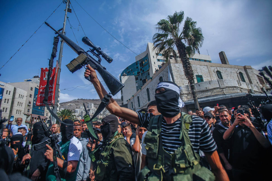 Gunmen seen shooting in air during the funeral of five Palestinians who were killed in an Israeli night raid in Nablus, Oct. 25, 2022 (Photo: Nasser Ishtayeh/SOPA Images/Sipa USA)