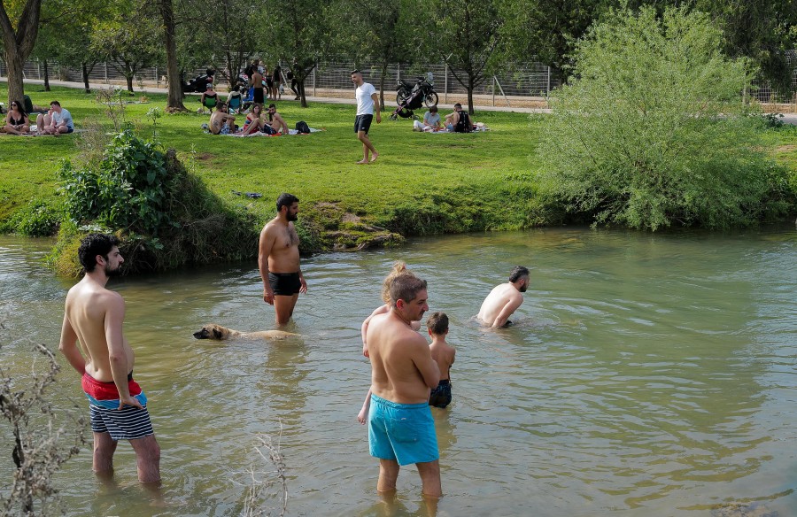 Israelis enjoy swimming in the Dan River, northern Israel, Apr. 2, 2022. (Photo: Michael Giladi/Flash90)
