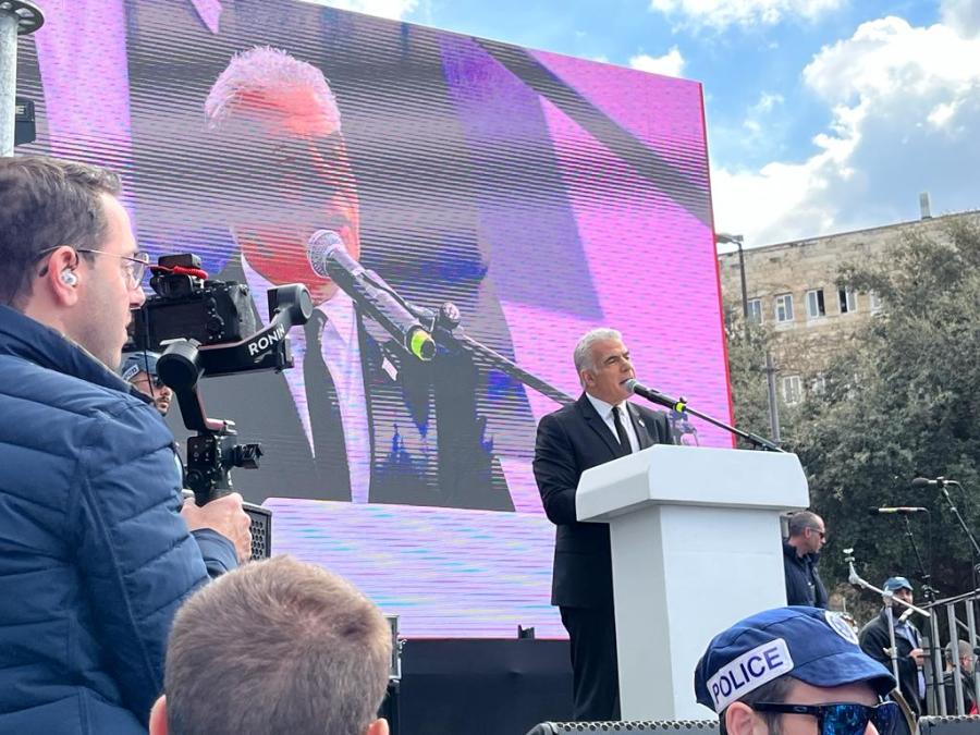 Opposition leader Yair Lapid speaks to protesters outside the Knesset in Jerusalem, Feb. 13, 2023 (Photo: ALL ISRAEL NEWS)