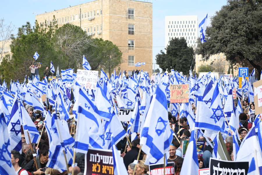 Thousands wave the Israeli flag as they protest the judicial reforms, outside the Knesset in Jerusalem, Feb. 13, 2023. (Photo: Arie Leib Abrams/Flash90)