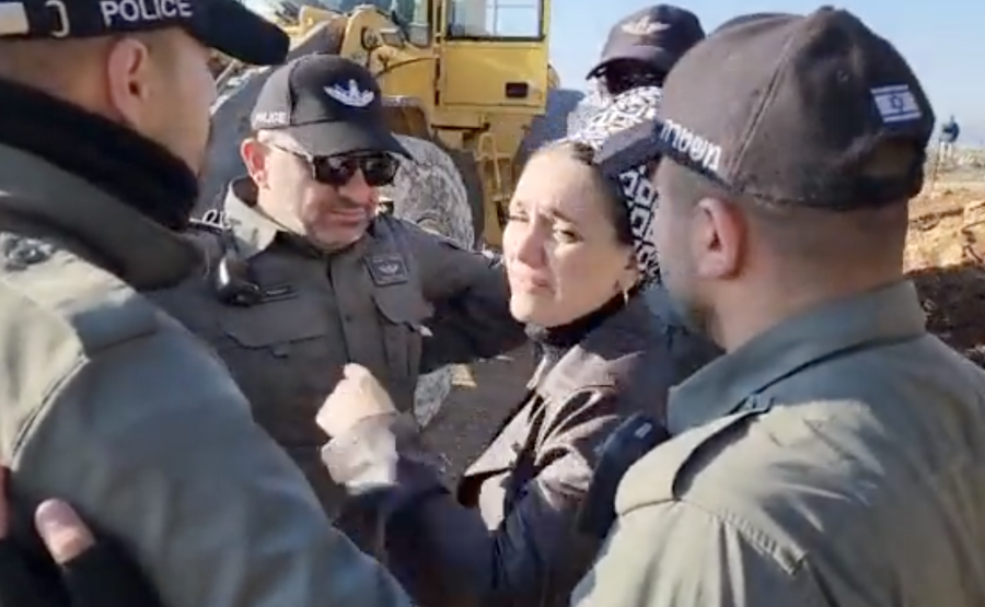 Jewish Power MK Limor Son Har Melech surrounded by police as she protests the removal of a West Bank settler's illegally planted orchard, Feb. 15, 2023 (Photo: Screenshot/Twitter)