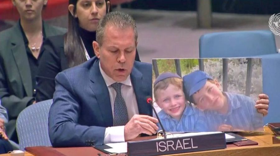 Israel's Ambassador Gilad Erdan, holds picture of Israeli children murdered in a recent terror attack, during a speech at UN Security Council, Feb. 20, 2023.
(Photo: Israel's Mission to the UN)