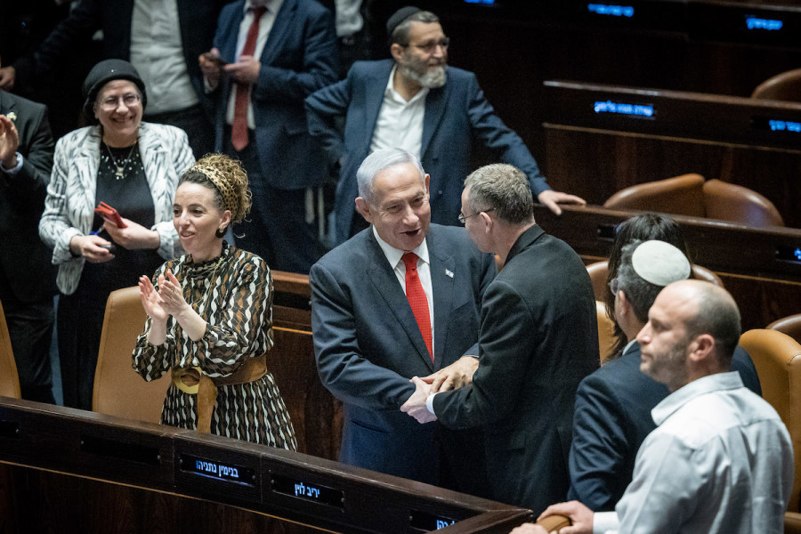 Israeli Prime Minister Benjamin Netanyahu, Justice Minister Yariv Levin and coalition members celebrate after a vote on the government's judicial overhaul plans in the Knesset assembly hall in Jerusalem, Feb. 21, 2023. (Photo: Yonatan Sindel/Flash90)