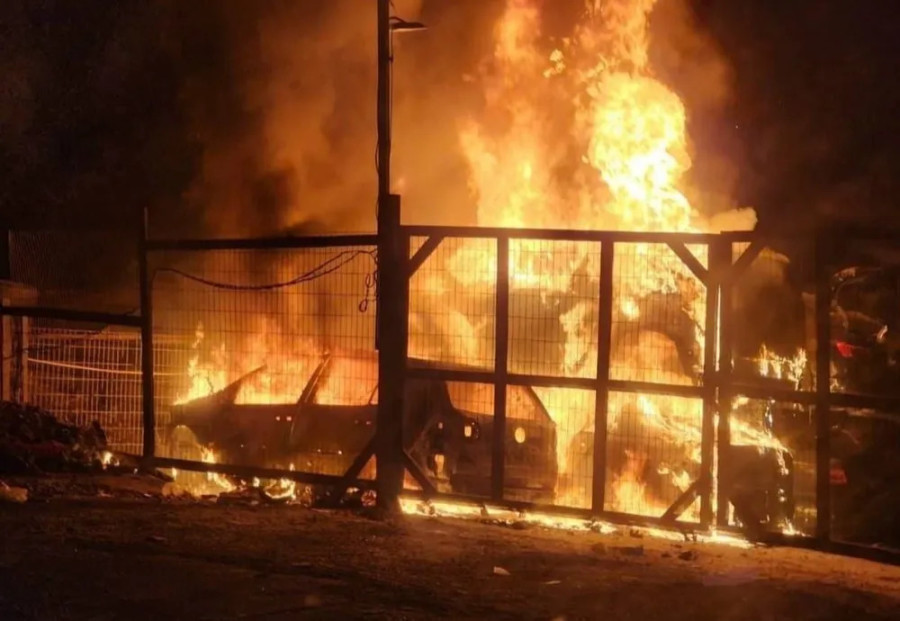 View of cars burning during riots by Jewish settlers in Hawara, in near Nablus, Feb. 27, 2023. (Photo from social media)