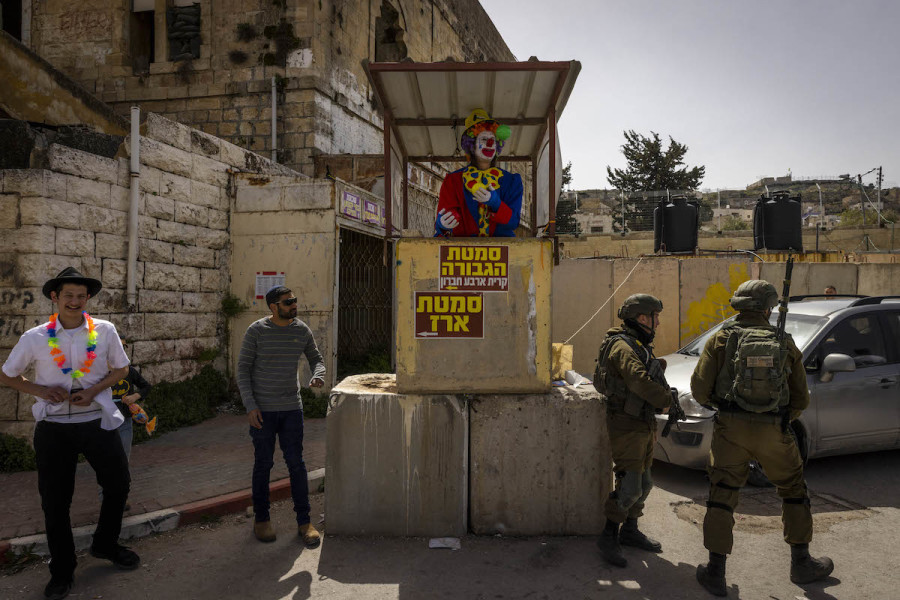 Jewish settlers wearing costumes take part in the annual parade marking the Jewish holiday of Purim in the divided town of Hebron, Mar. 17, 2022. (Photo: Olivier Fitoussi/Flash90)