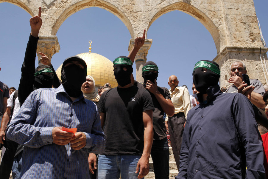 Illustrative - A group of masked Palestinians in the courtyard of Al-Aqsa Mosque in Jerusalem, Aug. 4, 2017. (Photo: Sliman Khader/Flash90)