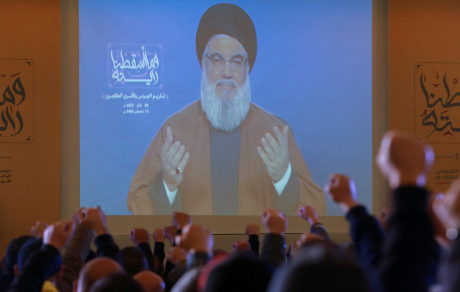 Lebanon's Hezbollah leader Hassan Nasrallah gestures as he appears on a screen, addressing his supporters, during a rally in Nabatieh, Lebanon, Mar. 6, 2023. (Photo: REUTERS/Aziz Taher)