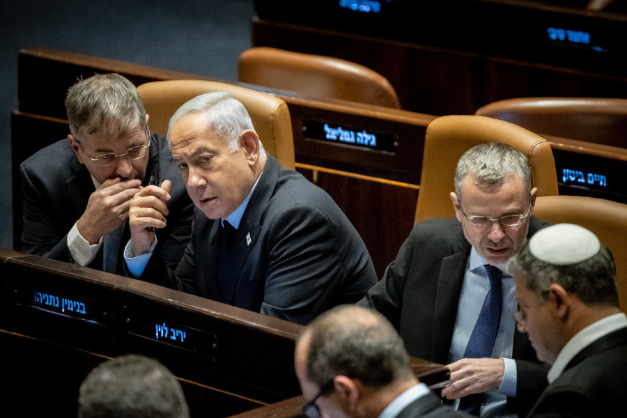Israeli Prime Minister Benjamin Netanyahu speaks with Minister of Education Yoav Kisch during a discussion and a vote in the Knesset assembly hall in Jerusalem, Mar. 22, 2023. (Photo: Yonatan Sindel/Flash90)