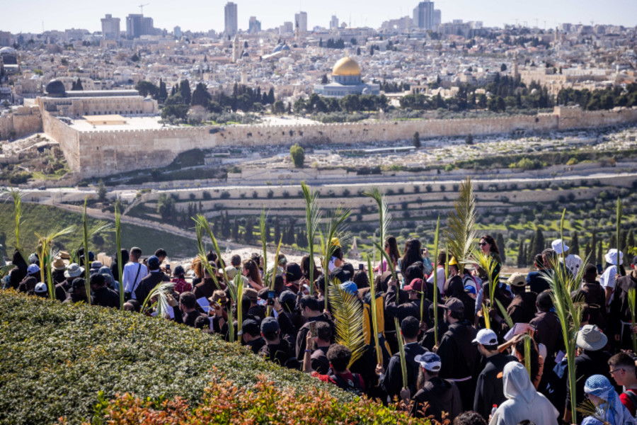 Christian pilgrims take part in the traditional Palm Sunday procession on the Mount of Olives ,Sunday, April 2, 2023. Palm Sunday commemorates Jesus Christ's triumphant entry into Jerusalem, and is the start of the Christian Holy Week. Photo by Erik Marmor/Flash90